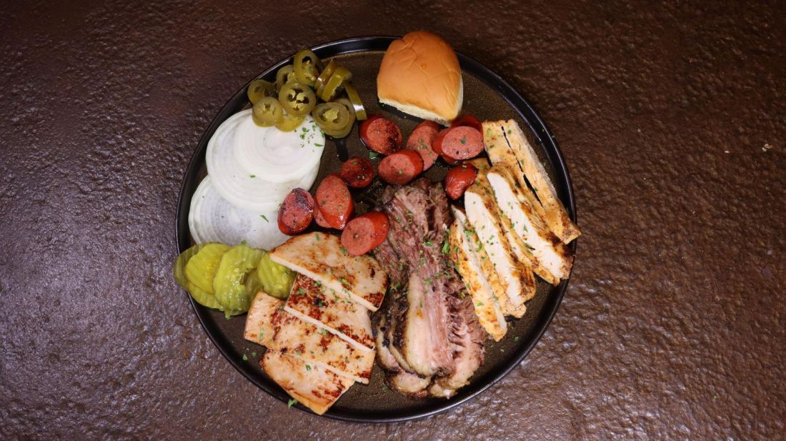 BBQ meat plate with brisket, sausage and grilled chicken
