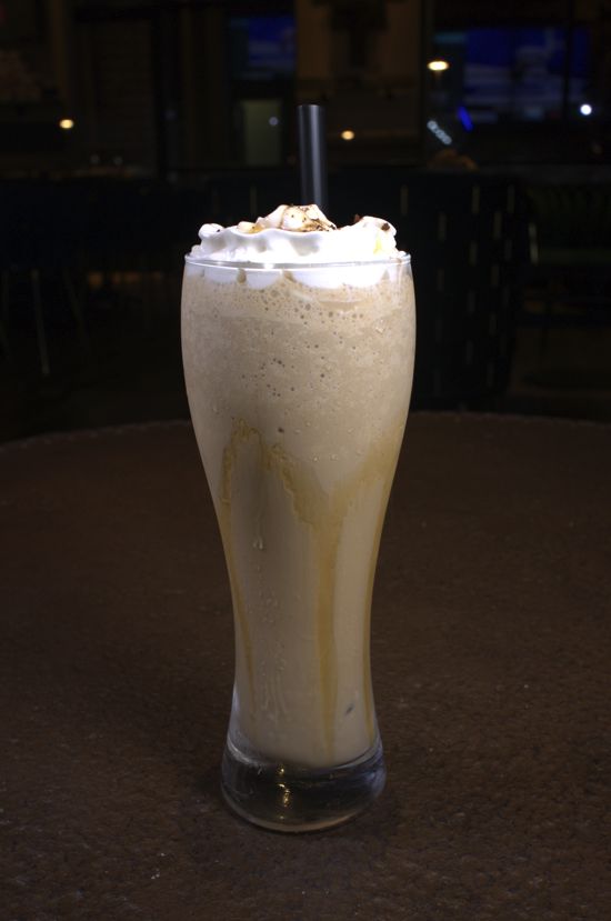 Iced coffee topped with whipped cream and caramel
