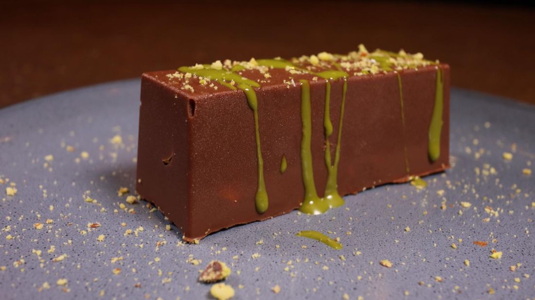 Chocolate dessert bar with a pistachio drizzle